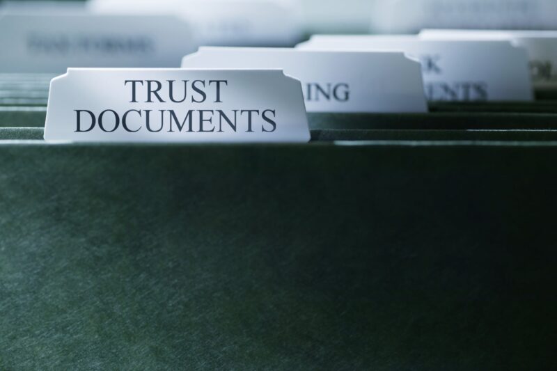 File drawer with labeled dividers reading Trust Documents, Planning, and Documents