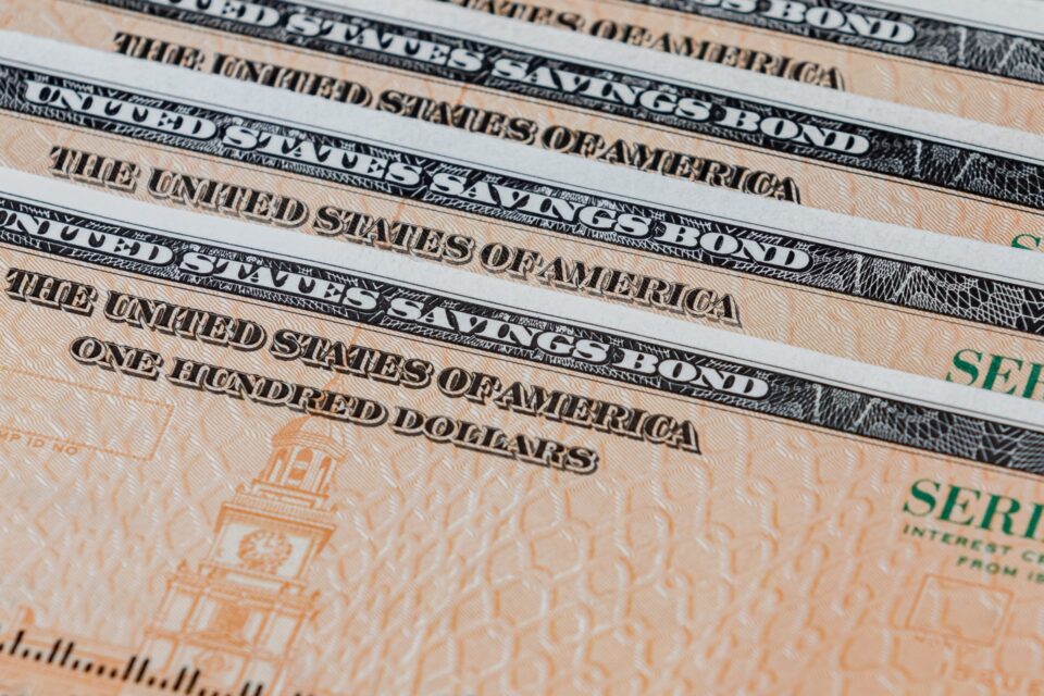 Stack of United States Savings Bond certificates fanned out